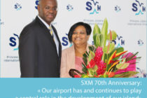 PJIAE. Gov. Holiday Presents LaBega with Bouquet of Flowers on SXM 70th Anniversary