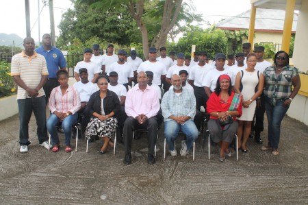Justice Academy cadets were thanked last week Friday by the Minister of Public Health Hon. Cornelius de Weever (4th from left) for their assistance in the country’s campaign to combat mosquito breeding sites.  Also in the picture is staff from CPS along with officials from the Justice Academy. DCOMM Photo