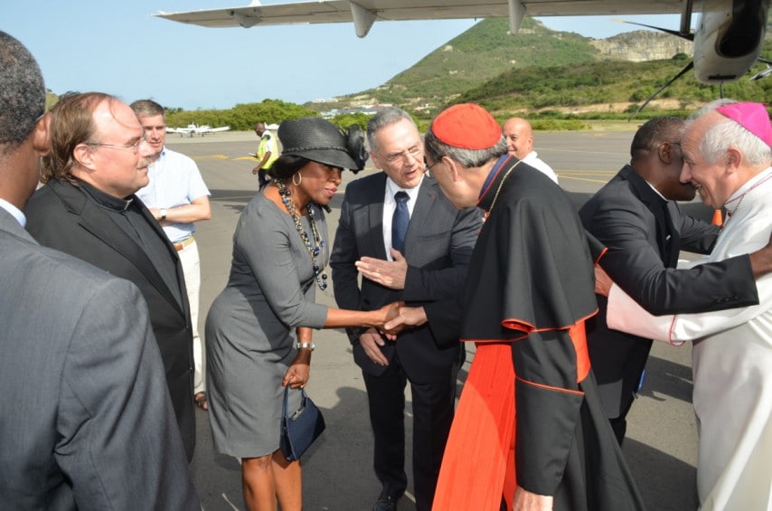 Father Bob Johnson (2nd from left), President of Parliament Hon. Gracita Arrindell (3rd from left) greeting Cardinal Archbishop Philippe Barbarin, Prefet Philippe Chopin, introducing the Cardinal to the President, while Bishop Jean-Yves Riocreux (1st right) is being greeted. 