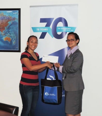 Ms. Suenah Martis of the SSA (left) is seen receiving the sponsorship check from Suzy Kartokromo, Acting Manager, Marketing and Customer Service Dept., SXM Airport. (SXM photo)