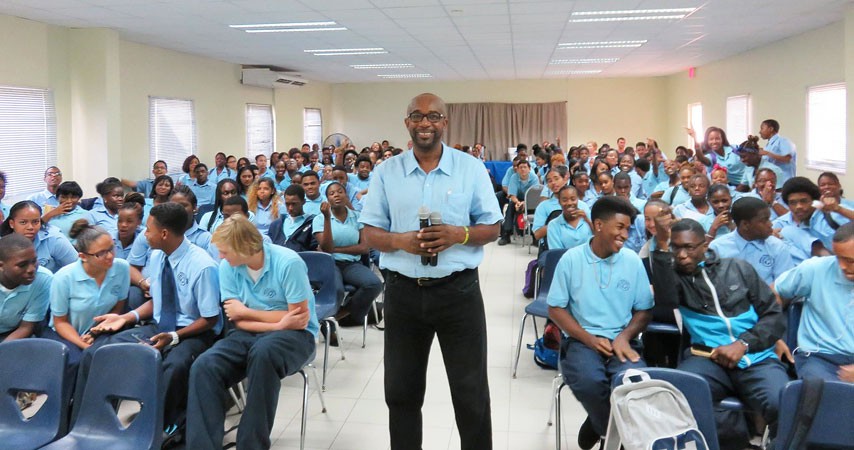 Caption:  President of Conscious Lyrics Foundation (CLF), Shujah Reiph (center, standing), takes a break with 170 high school students from MPC, at a Black History Month lecture and movie screening, University of St. Martin, February 11, 2015. (Photo courtesy CLF)