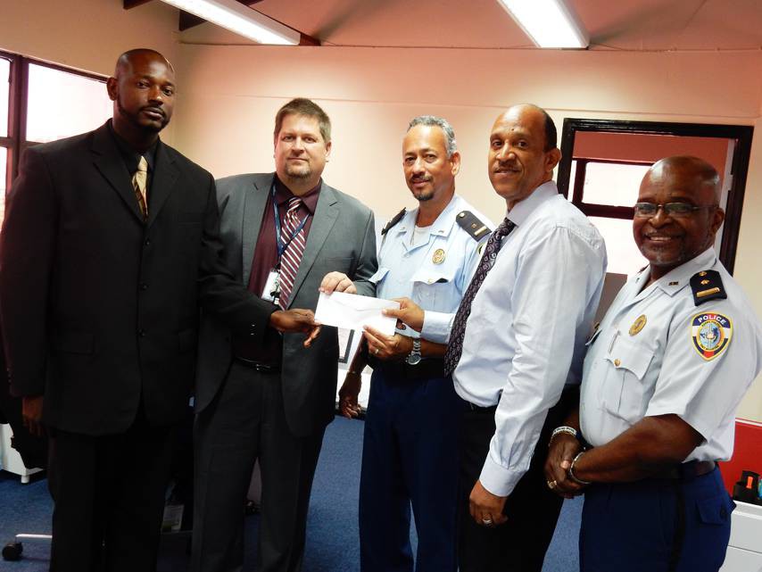 From L-R: P3 members; Gerard Lake and Michael Kanaby from the American University, Chief Inspector Benjamin Gout, Eric Ellis of Nagico Insurances & Chairman of P3 and Police Spokesman; Chief Inspector Ricardo Henson pose for a photo during the presentation yesterday at the Dispatch Center.