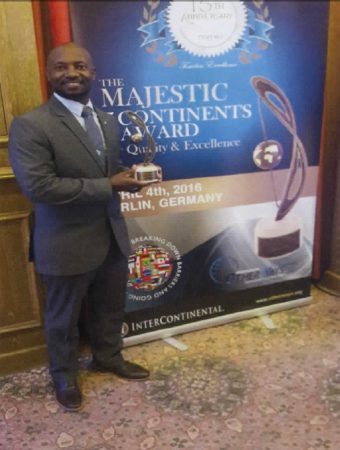 Mr. Anastacio Baker holding the Quality and Excellence Award granted to SXM Airport. (SXM photo)